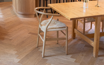 Elegant herringbone parquet in a dining area